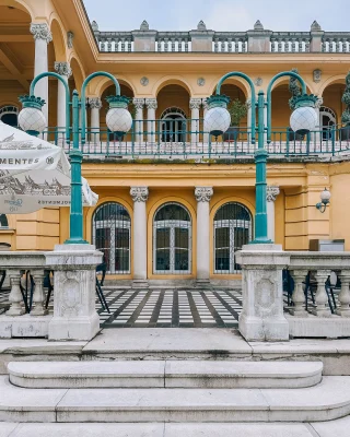 - The Széchenyi Thermal Baths -

Szechenyi Baths in Budapest is one of the largest spa baths in Europe with its 15 indoor baths and 3 grand outdoor pools,  saunas, steam rooms and even a rooftop spa greenhouse. It has become the must have thermal baths to visit when in Budapest 

I decided to spend my last morning at Széchenyi thermal baths . I pre booked the fast track morning ticket with cabin at €41. This gave me entrance before 11am , fast track so no queues. 

I find my cabin and changed into my swimsuit and headed first to the outside pools , the ones you see all over social media. One of the pools was closed for maintenance. The swimming lanes pool and the hot thermal baths were open. 

The baths are beautiful against the yellow facade of the Szechenyi Thermal Bath building, but they my friend is where the positive ends I’m afraid 

Here comes the most likely unpopular opinion !

The outside bath was full of what were most likely hen and stag do’s, very busy and noisy . It dawned on me that I was ‘bathing ‘ with the best part of 100 people , not quite what I had in mind .

After a lovely swim in the lap pool I headed inside to experience the other 12 baths. 
Unfortunately the inside has very little architectural features and is very clinical. Again it was very busy which I personally didn’t like . One of the pools I went into , I stepped out immediately as there was ‘stuff’ floating about, I was not the only one who got out swiftly too. 

My honest opinion , I’m not sure it was worth the money. I can see the attraction to many from the outside pools , for me overall, it felt jaded and cleanliness was lacking in places. 
I much preferred the quieter more relaxed Gellert Baths , and the architecture was stunning . ( see previous post ) 

📍 H-1146 Budapest, Állatkerti körút 9-11

Széchenyi thermal baths | Budapest thermal baths | Honest review of Széchenyi thermal baths

#travelover50 #over50travel #midlifetravel #midlifewomen #solotravelstories #solotravelingisfun #visitbudapest #thermalbaths #thermalbathszéchenyi #traveltobudapest #visithungary #budapesttravel #budapestagram #budapestspa